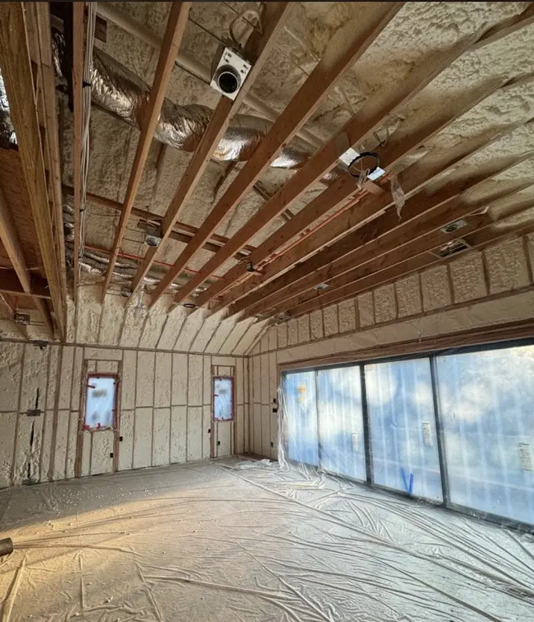 Interior walls and ceiling insulated with spray foam during new construction in West Caldwell